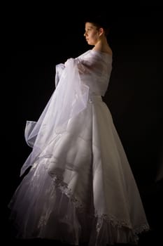 people series: fiancee in the white bridal dress over black background