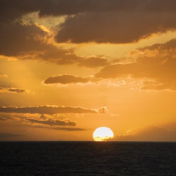 Sunset over Pacific Ocean in Maui, Hawaii, USA.