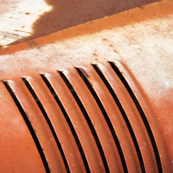 Abstract close up of vent on old automobile.