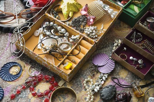 Above view of open jewelry box sitting on top of dresser.