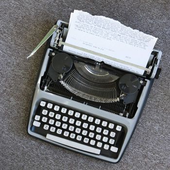 Overview of typewriter with paper that has been typed on.