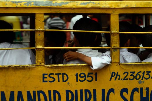 young people in school bus - India