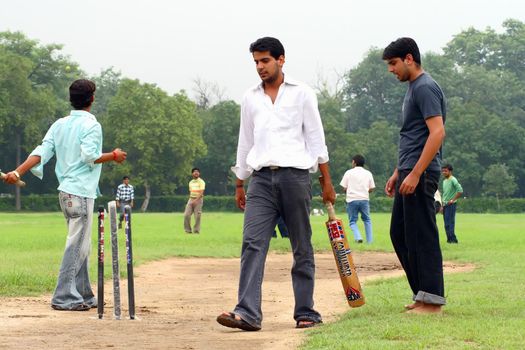 a cricket batsman in action during a cricket match