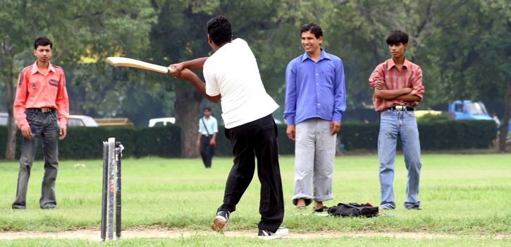 a cricket batsman in action during a cricket match