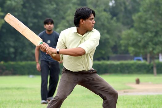 a cricket batsman in action during a cricket match