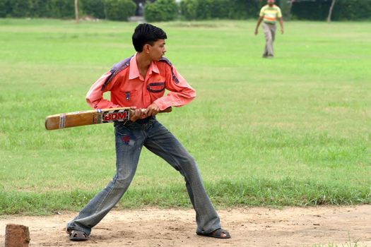 a cricket batsman in action during a cricket match