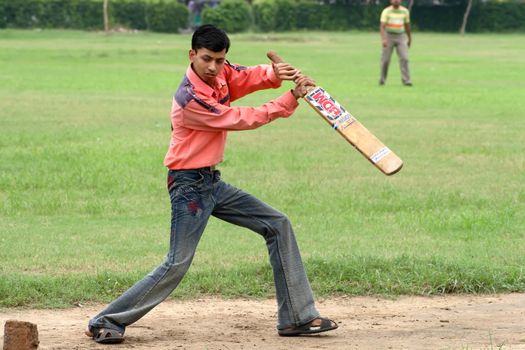 a cricket batsman in action during a cricket match