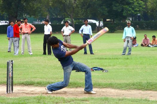 a cricket batsman in action during a cricket match