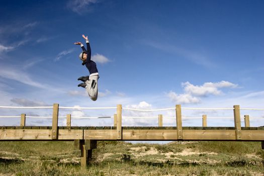 Young woman jumping for fun in a beautiful day