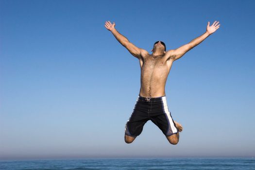 Man jumping on the beach