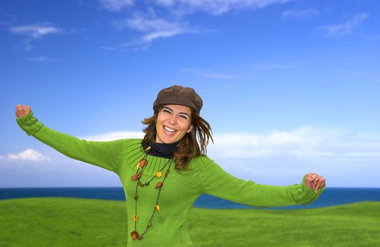 Happy woman in a great beautiful landscape