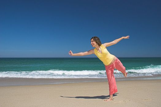 Beautiful woman making poses in the beach