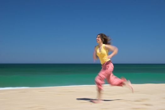 Woman runing on the beach
