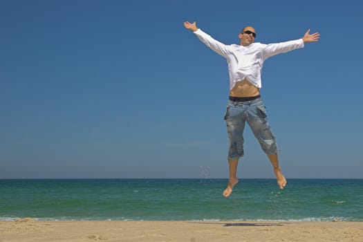 Man jumping on the beach