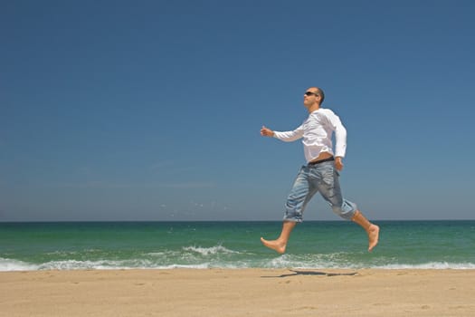 Man jumping on the beach