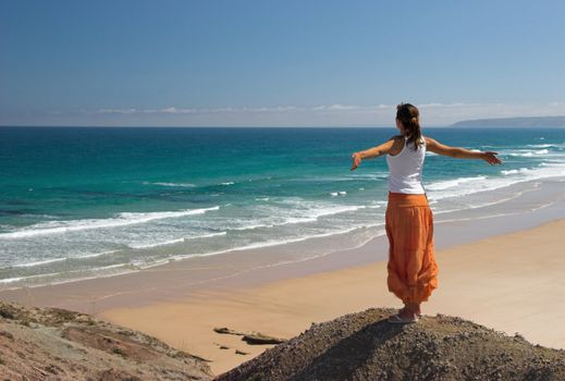 Woman feeling the wind with open arms