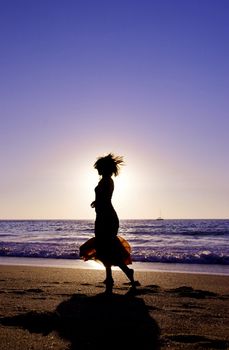 Woman silhouette at the sunset