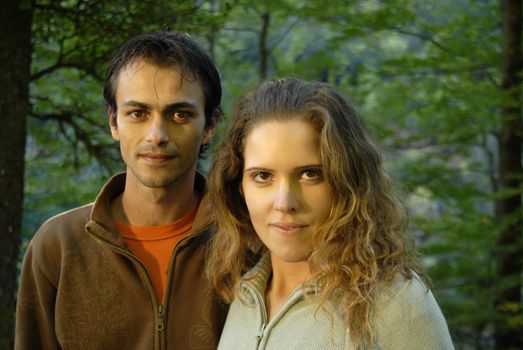 young fashion couple portrait at the forest