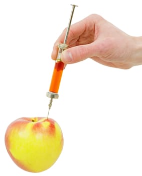 Hand with a syringe doing an injection to an apple on the white background