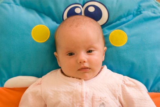 2 month old baby girl on the playmat.