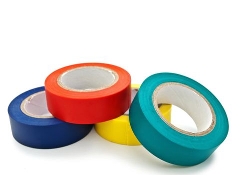 Photo of multicolored insulating tapes against the white background