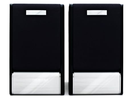 two modern loudspeakers against the white background