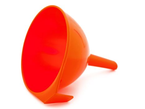red plastic kitchen funnel against white background 