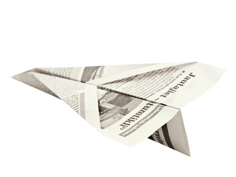 newspaper airplane against white background
