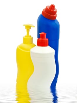Detergent bottles over white background