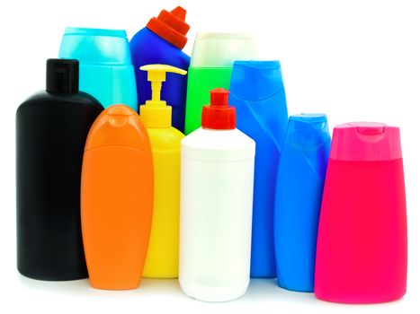 different toiletries plastic bottles over white background