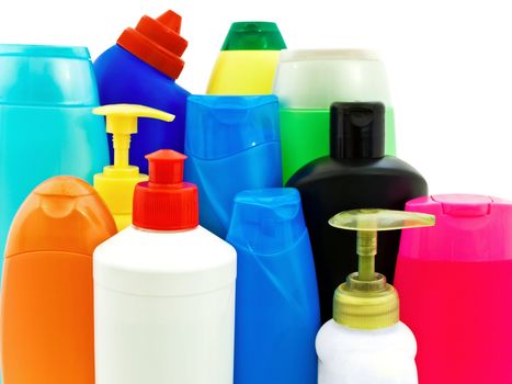 two plastic blue bottles of shampoo over white