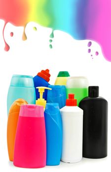 different toiletries plastic bottles over the white