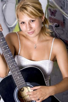 beautiful girl holding a guitar