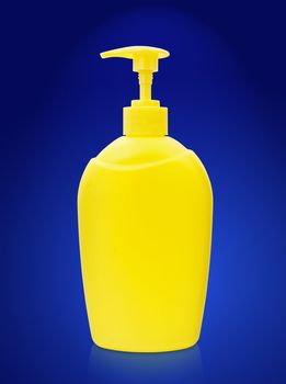 single plastic bottle of liquid soap over the blue
