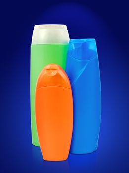 different toiletries plastic bottles over the blue
