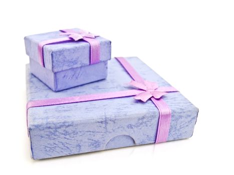Two gift boxes with bow against white background
