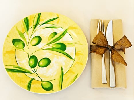 decorated table serving with serviette and knife,fork at beige 