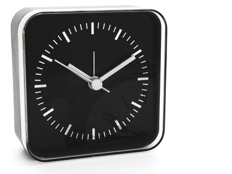 modern black clock with old watch reflection against white