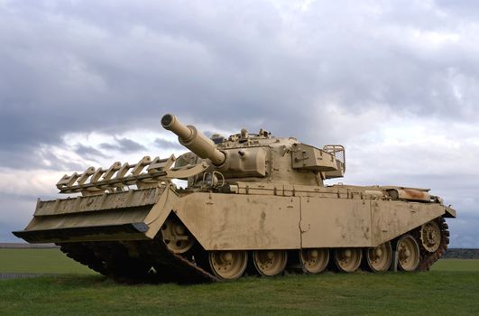 A tank against a stormy sky