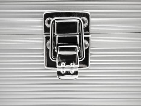 close up view on aluminum box lock 