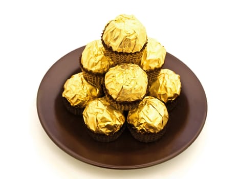 confection heap on the saucer over white 