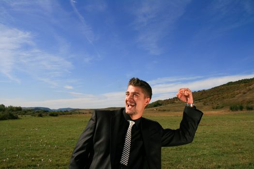 Business man enjoying the news of his success.