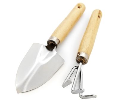 Different gardening tools against white background