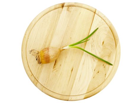 Onion bulb green sprout at natural wooden board for cutting vegetables against white