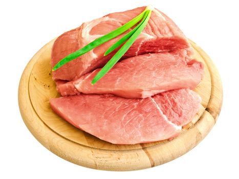 piecies of meat with onion on the hardboard