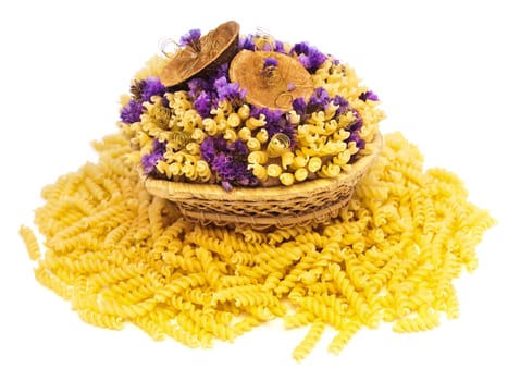 yellow pasta and flowers in the basket