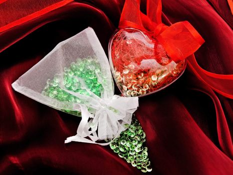 sack with gems near gift heart over chic bordeaux textile