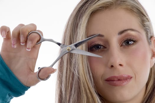 woman showing scissor on an isolated background