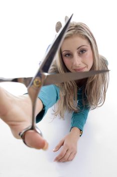 woman showing scissor on an isolated background