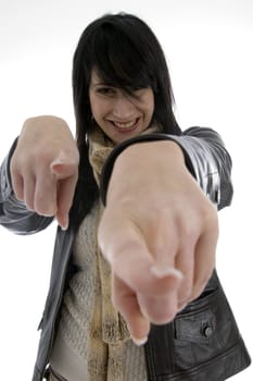 cheerful woman pointing towards camera on an isolated white background